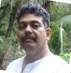 Venky Mahadevan cofounder wiggles india with dark hair and a mustache wearing a white shirt